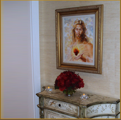 A painting of jesus is hanging on the wall.